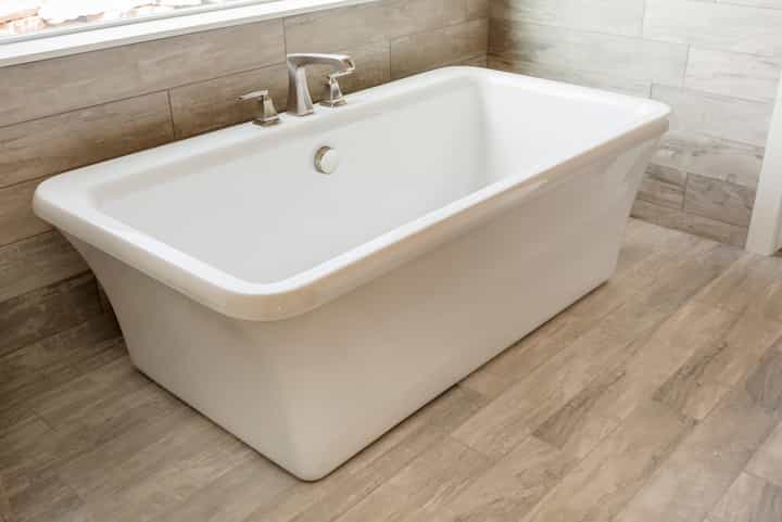 A luxury soaking white ceramic bathtub installation for Yuba City, California